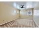 Large bedroom with ceiling fan and dual windows at 15955 N Cristine Ln, Surprise, AZ 85388