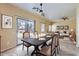 Dining room showcasing open floor plan and backyard access through sliding glass door at 15955 N Cristine Ln, Surprise, AZ 85388