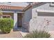 Close up of front entrance showing covered porch and desert landscaping at 15955 N Cristine Ln, Surprise, AZ 85388