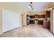 Spacious kitchen boasts stainless steel appliances, ample counter space, and tile floors at 15955 N Cristine Ln, Surprise, AZ 85388