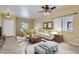 Staged living room featuring tile floors, neutral paint and modern decor at 15955 N Cristine Ln, Surprise, AZ 85388