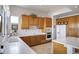 Bright kitchen featuring custom wood cabinets and modern appliances with a beautiful view from the window at 16364 E Ridgeline Dr, Fountain Hills, AZ 85268