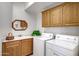 Laundry room featuring a sink, cabinets, and washer and dryer at 16364 E Ridgeline Dr, Fountain Hills, AZ 85268
