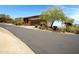 Exterior view of a home with desert landscaping, driveway, and an attached garage at 16364 E Ridgeline Dr, Fountain Hills, AZ 85268