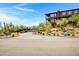Gated community entrance leading to a hillside home with an attached garage at 16364 E Ridgeline Dr, Fountain Hills, AZ 85268