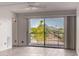 Bright and airy room showcasing a sliding glass door with a balcony and beautiful desert views at 16852 E La Montana Dr # C18, Fountain Hills, AZ 85268