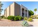 A neutral-toned building featuring manicured greenery and decorative gravel showcasing the building's exterior at 16852 E La Montana Dr # C18, Fountain Hills, AZ 85268