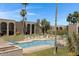 Community pool surrounded by manicured landscaping and lounge chairs, perfect for relaxation at 16852 E La Montana Dr # C18, Fountain Hills, AZ 85268