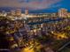 Aerial view showcasing the residential neighborhood with illuminated cityscape at dusk at 17 W Vernon Ave # 508, Phoenix, AZ 85003