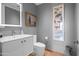 Charming bathroom featuring modern vanity, decorative mirror, and stylish decor at 17 W Vernon Ave # 508, Phoenix, AZ 85003