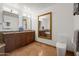 Bathroom with dual sinks, beautiful granite countertops, and decorative tile flooring at 17 W Vernon Ave # 508, Phoenix, AZ 85003