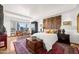 Beautiful bedroom featuring a seating area, city views, and hardwood accents at 17 W Vernon Ave # 508, Phoenix, AZ 85003