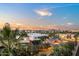 View showcasing an urban landscape with city buildings and trees during a colorful sunset at 17 W Vernon Ave # 508, Phoenix, AZ 85003