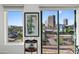 Bright condo showcasing a stunning city view through large windows with access to outdoor balcony at 17 W Vernon Ave # 508, Phoenix, AZ 85003