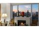 Living room showcasing an urban landscape with statues on the fireplace during a colorful sunset at 17 W Vernon Ave # 508, Phoenix, AZ 85003