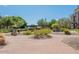 Beautiful exterior common area with drought-resistant landscaping, hardscape, and mature trees at 17 W Vernon Ave # 508, Phoenix, AZ 85003