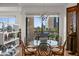 Elegant dining area with natural light, modern chandelier, and city views at 17 W Vernon Ave # 508, Phoenix, AZ 85003
