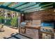 Built-in outdoor grilling area with stainless steel gas grills and brick facade at 17 W Vernon Ave # 508, Phoenix, AZ 85003