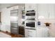 Kitchen features stainless steel appliances, white cabinets, wine cooler, and integrated appliances at 17 W Vernon Ave # 508, Phoenix, AZ 85003