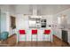 Gourmet kitchen features a waterfall island with seating and stainless steel appliances and finishes at 17 W Vernon Ave # 508, Phoenix, AZ 85003