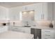Modern kitchen features sleek white cabinetry, stainless steel appliances, and a stylish backsplash at 17 W Vernon Ave # 508, Phoenix, AZ 85003