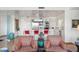 Open concept kitchen and living room with bar top seating, modern lighting, and comfortable seating at 17 W Vernon Ave # 508, Phoenix, AZ 85003