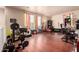 Spacious bonus room with hardwood floors and large windows provides ample natural light at 17153 W Gambit Trl, Surprise, AZ 85387