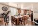 Eat-in kitchen features a dining table, center island, modern appliances, and tile flooring at 17153 W Gambit Trl, Surprise, AZ 85387