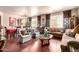 Elegant living room with hardwood floors, sophisticated furnishings, and a bright, airy atmosphere at 17153 W Gambit Trl, Surprise, AZ 85387