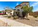 A charming home with mature landscaping and desert landscaping at 17153 W Gambit Trl, Surprise, AZ 85387