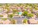 Aerial view of homes and the community pool featuring mature trees, desert landscaping, and parking at 17606 N 17Th Pl # 1096, Phoenix, AZ 85022