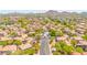Beautiful aerial view of the desert community, pool, mountains, and surrounding landscape at 17606 N 17Th Pl # 1096, Phoenix, AZ 85022