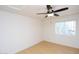 Bedroom with light-colored wood floors, a ceiling fan, and a window with blinds at 17606 N 17Th Pl # 1096, Phoenix, AZ 85022