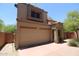 Two-story home with a neutral-colored stucco exterior, red tile roof, and a two-car garage at 17606 N 17Th Pl # 1096, Phoenix, AZ 85022