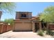 Two-story home with a neutral-colored stucco exterior, red tile roof, and a two-car garage at 17606 N 17Th Pl # 1096, Phoenix, AZ 85022