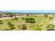 Expansive view of the golf course featuring mature trees and manicured landscaping under a bright blue sky at 17606 N 17Th Pl # 1096, Phoenix, AZ 85022