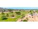 Scenic view of the golf course and community featuring mature trees and desert landscaping under a bright blue sky at 17606 N 17Th Pl # 1096, Phoenix, AZ 85022