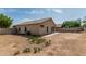 Back exterior view of home showcasing potential for landscaping and outdoor living at 17828 W Calavar Rd, Surprise, AZ 85388