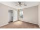 Bedroom with ample natural light and featuring a large closet with sliding doors at 17828 W Calavar Rd, Surprise, AZ 85388