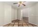 Open-concept room featuring tile floors, wainscoting, and an open concept layout at 17828 W Calavar Rd, Surprise, AZ 85388