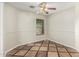Cozy bonus room featuring tile floors, wainscoting, and a view of the backyard at 17828 W Calavar Rd, Surprise, AZ 85388