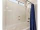 Bright and clean shower/tub combo featuring an adjustable shower head at 17828 W Calavar Rd, Surprise, AZ 85388