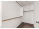 Walk-in closet with ample shelving and storage space for all your wardrobe needs at 17828 W Calavar Rd, Surprise, AZ 85388