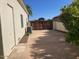 Long driveway leads to a private gate and lush landscaping at 18029 W San Miguel Ave, Litchfield Park, AZ 85340