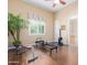 Home gym featuring wood floors, a stationary rower, and an exercise bench, promoting a healthy lifestyle at 18029 W San Miguel Ave, Litchfield Park, AZ 85340