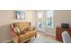 A comfortable sitting area is located near a set of french doors that lead to the outside at 18029 W San Miguel Ave, Litchfield Park, AZ 85340