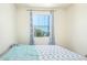 Bright bedroom features a large window with patterned curtains and a comfortable bed with stylish bedding at 18637 W Williams Rd, Surprise, AZ 85387