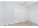 Light blue bedroom features light wood floors and a double door closet at 18637 W Williams Rd, Surprise, AZ 85387