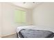 Simple bedroom features carpet and window with a cellular shade at 18637 W Williams Rd, Surprise, AZ 85387