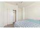 Cozy bedroom with carpet and a closet features comfortable bed with stylish patterned bedding at 18637 W Williams Rd, Surprise, AZ 85387